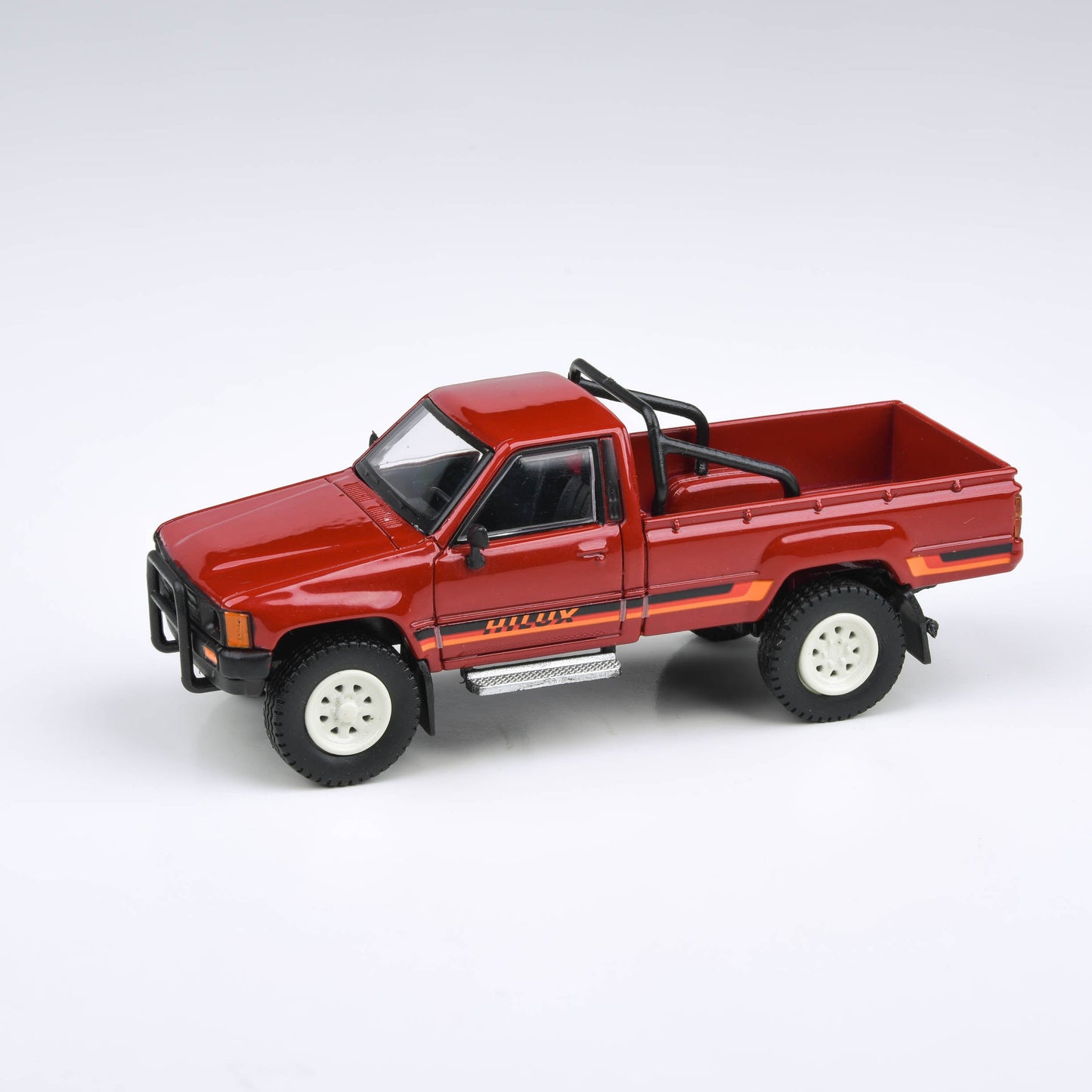 1:64 1984 Toyota Hilux Single Cab
Yellow / Red