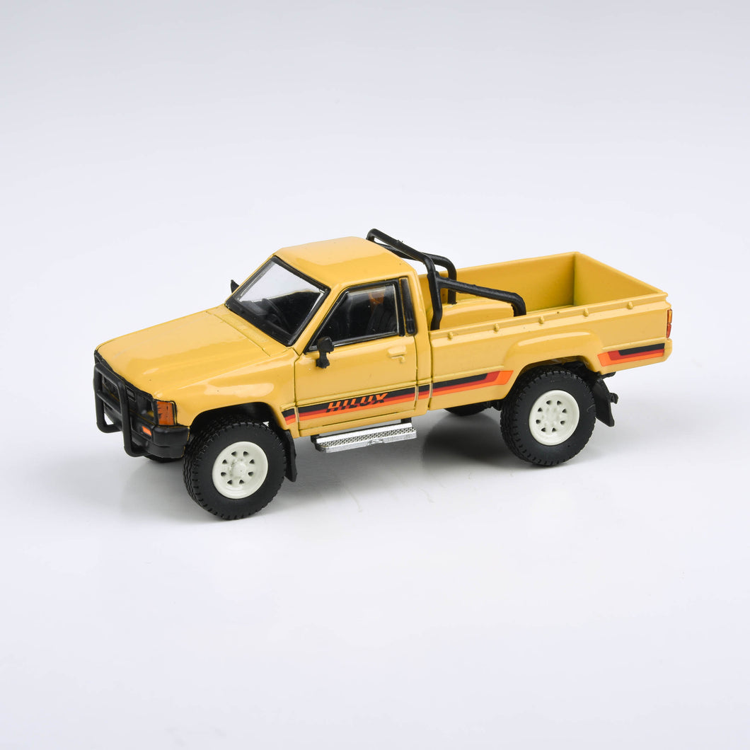 1:64 1984 Toyota Hilux Single Cab Yellow / Red