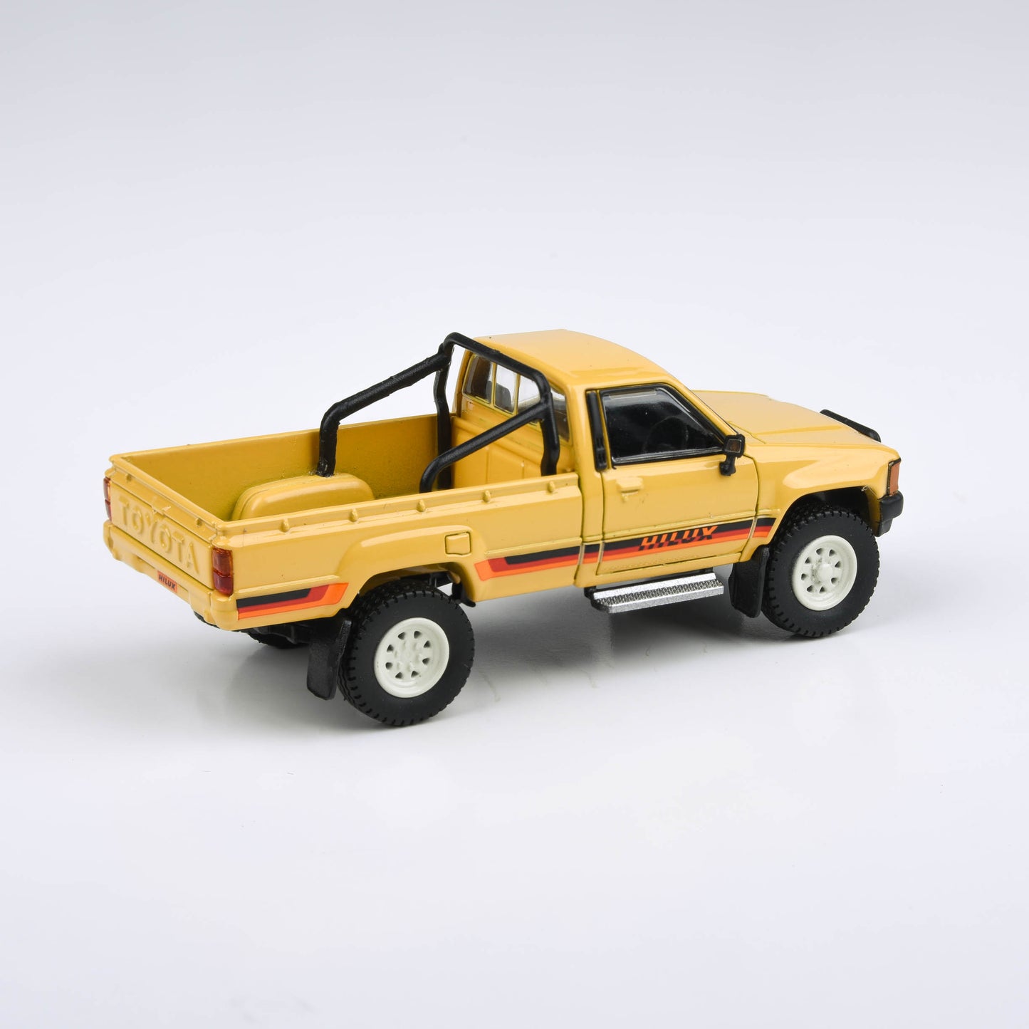 1:64 1984 Toyota Hilux Single Cab Yellow / Red