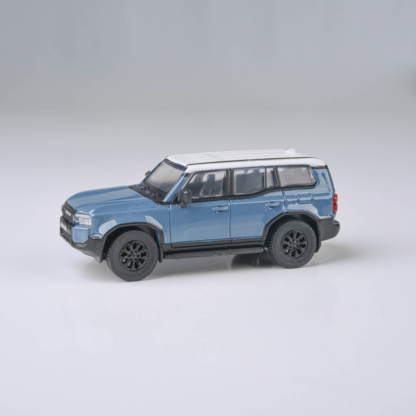 1:64 2024 Toyota Land Cruiser 250 Prado Heritage Blue / White Ice Cap